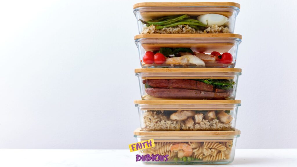 Food prep containers with food for a meal train.